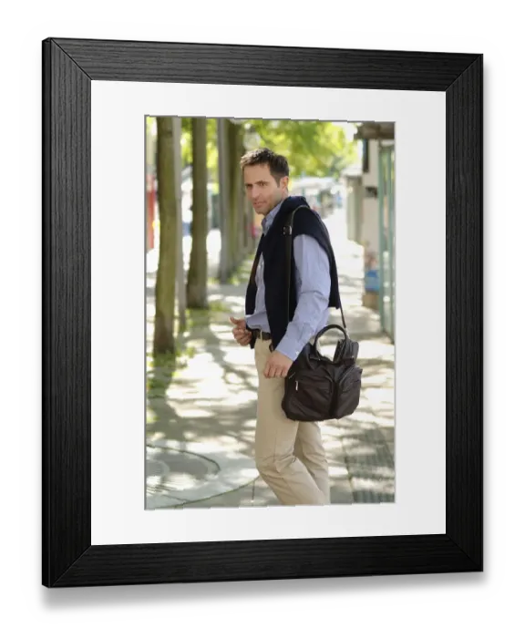 Framed Print : Man wearing casual clothes standing in an avenue Framed Print : Man wearing casual clothes standing in an avenue