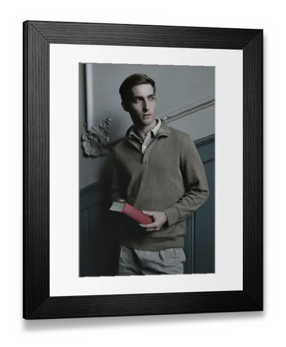 Framed Print : Man holding a book in the stairwell, nostalgic portrait Framed Print : Man holding a book in the stairwell, nostalgic portrait