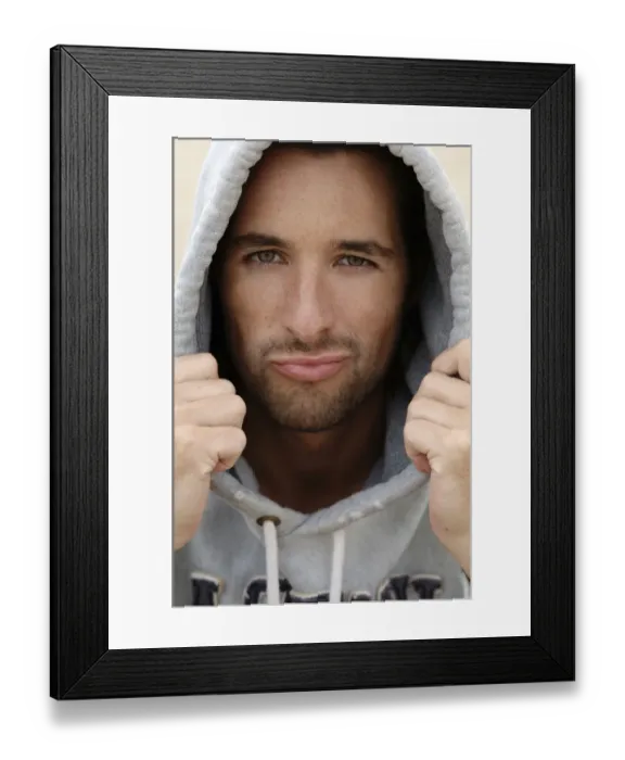 Framed Print : Man, early 30s, wearing a hooded sweater in bad weather at the beach, portrait Framed Print : Man, early 30s, wearing a hooded sweater in bad weather at the beach, portrait