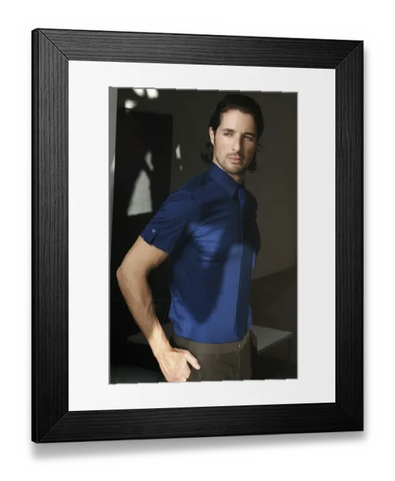 Framed Print : Man standing at a window, fashion shot