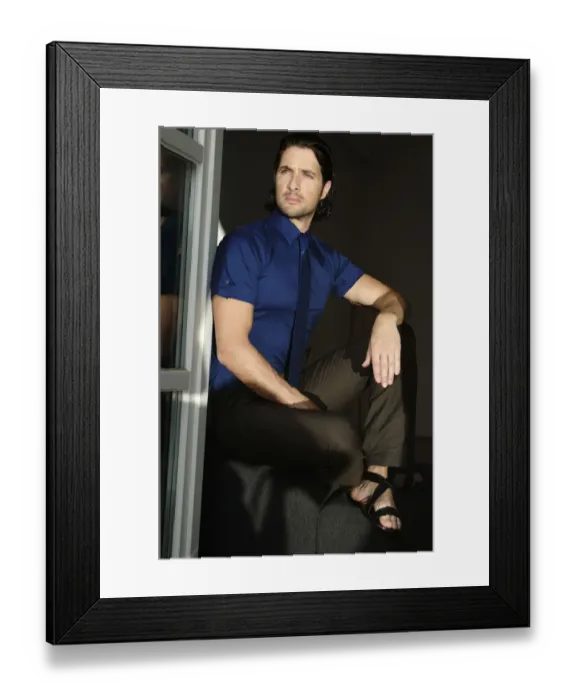 Framed Print : Man sitting by a window, fashion shoot Framed Print : Man sitting by a window, fashion shoot