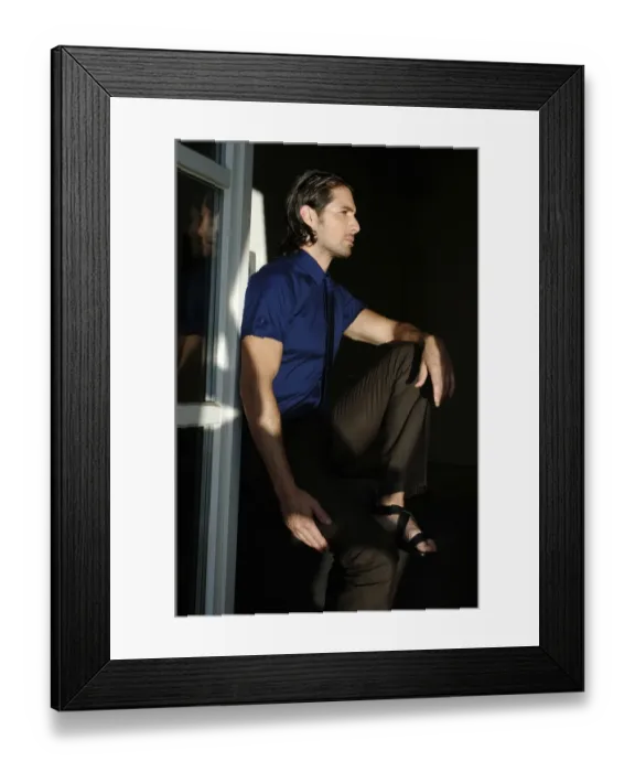 Framed Print : Man sitting by a window, fashion shoot Framed Print : Man sitting by a window, fashion shoot