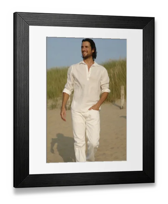 Framed Print : Man wearing white clothes walking in the dunes on the beach Framed Print : Man wearing white clothes walking in the dunes on the beach