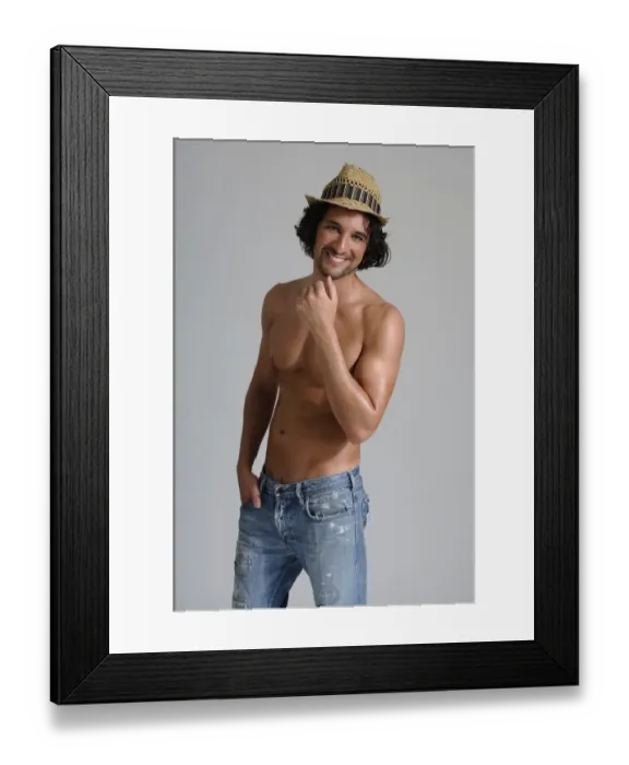 Framed Print : Athletic man, early 30s, bare-chested wearing jeans and a hat