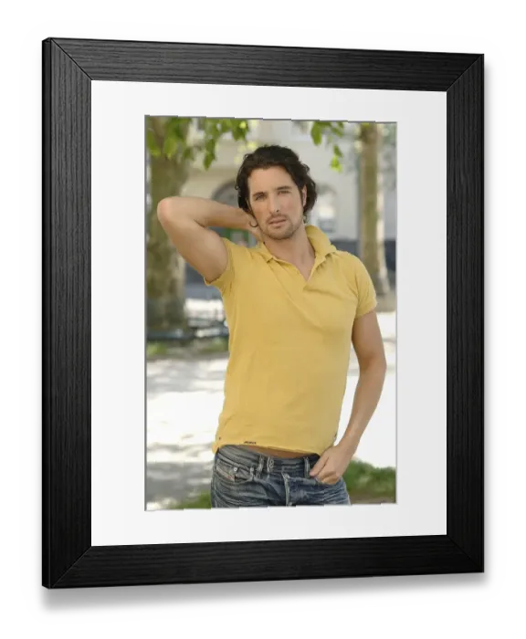 Framed Print : Portrait of a man in his early thirties with long, dark hair