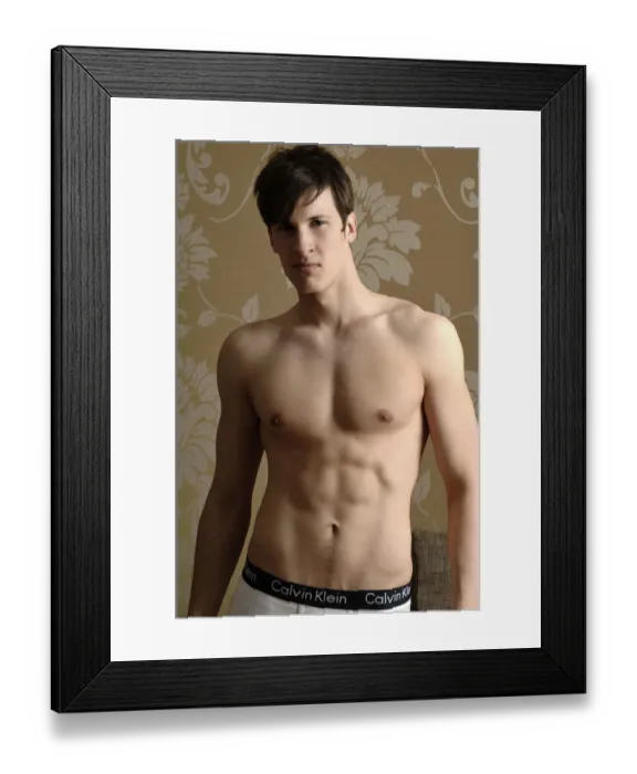 Framed Print : Young man wearing underwear standing in front of nostalgic wallpaper Framed Print : Young man wearing underwear standing in front of nostalgic wallpaper