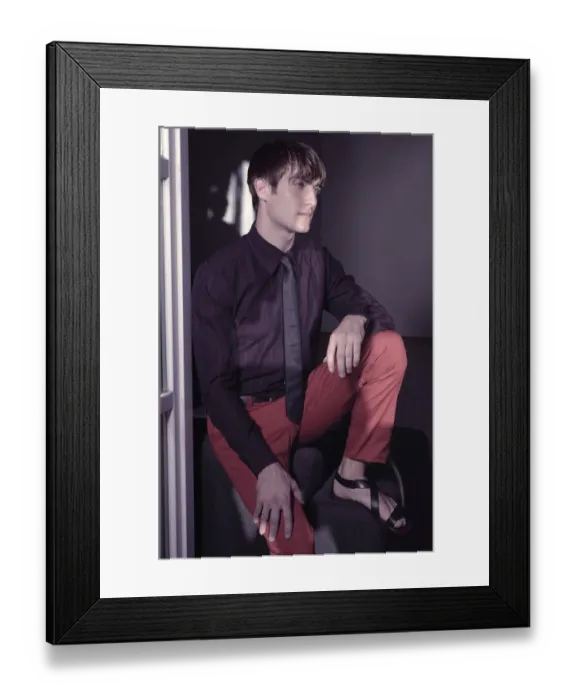 Framed Print : Man sitting at the window, fashion shoot Framed Print : Man sitting at the window, fashion shoot