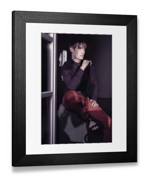 Framed Print : Man sitting at the window, fashion shoot Framed Print : Man sitting at the window, fashion shoot
