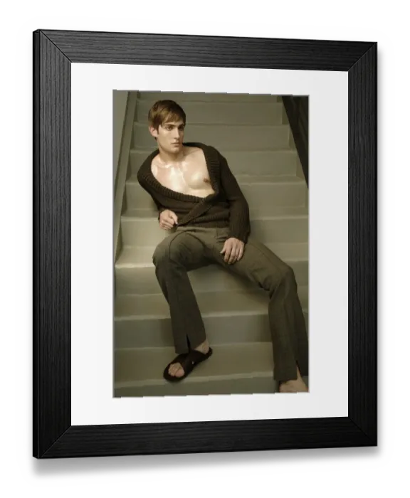 Framed Print : Young man sitting on the stairs Framed Print : Young man sitting on the stairs