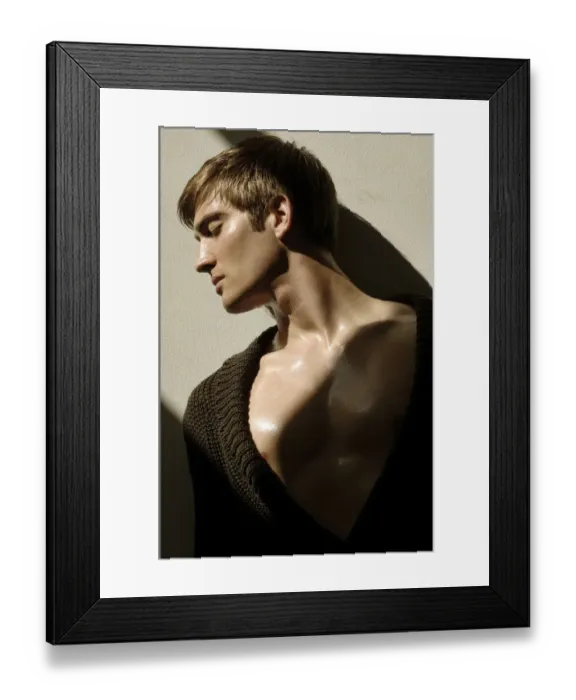 Framed Print : Portrait of a young man leaning on a wall in the sunlight Framed Print : Portrait of a young man leaning on a wall in the sunlight