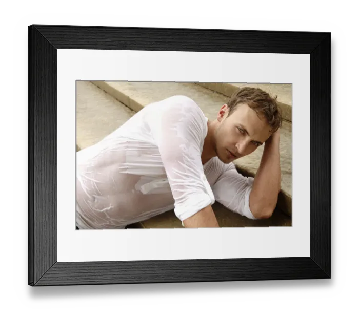 Framed Print : Young man wearing a wet shirt, lying on stairs Framed Print : Young man wearing a wet shirt, lying on stairs