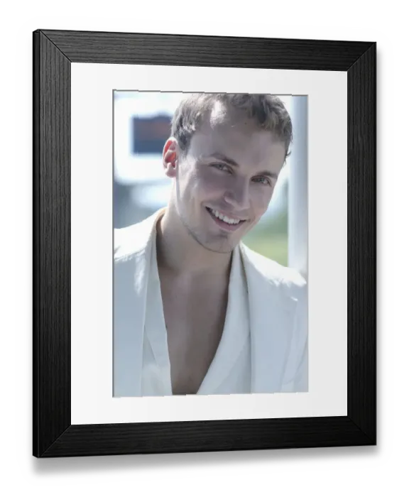 Framed Print : Young man wearing a white suit, smiling, portrait Framed Print : Young man wearing a white suit, smiling, portrait