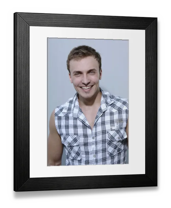 Framed Print : Young man smiling, wearing a check shirt, portrait Framed Print : Young man smiling, wearing a check shirt, portrait