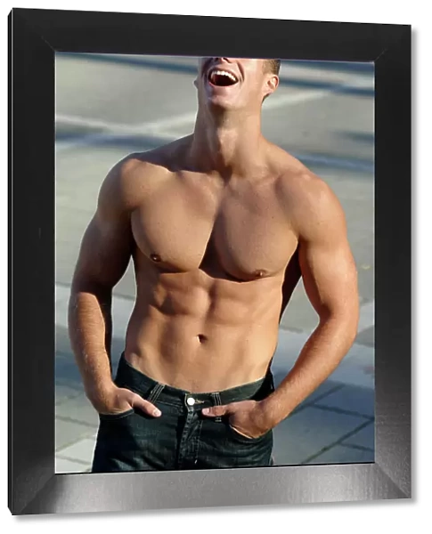 Bare-chested man laughing