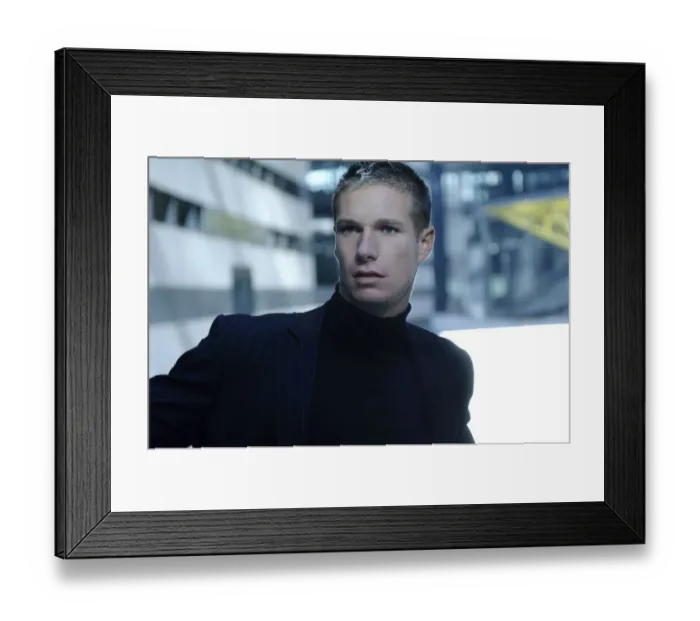Framed Print : Portrait of a businessman wearing a dark suit, bank building at the back Framed Print : Portrait of a businessman wearing a dark suit, bank building at the back