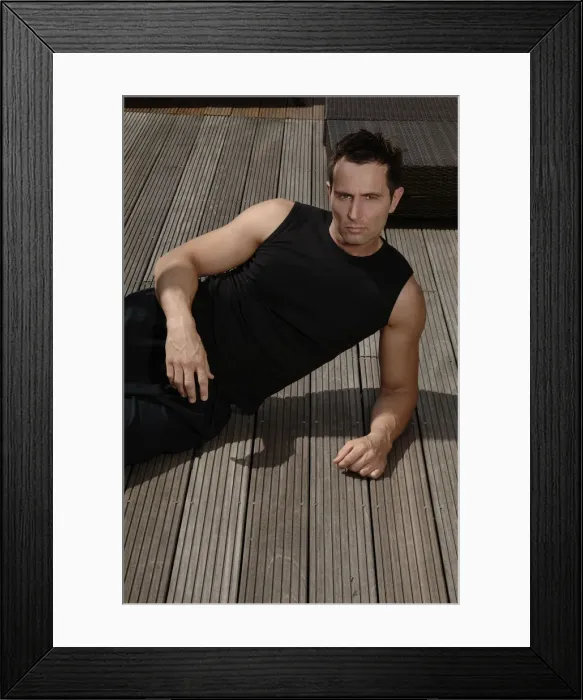 Framed Print : Young athletic man lying on a terrace Framed Print : Young athletic man lying on a terrace