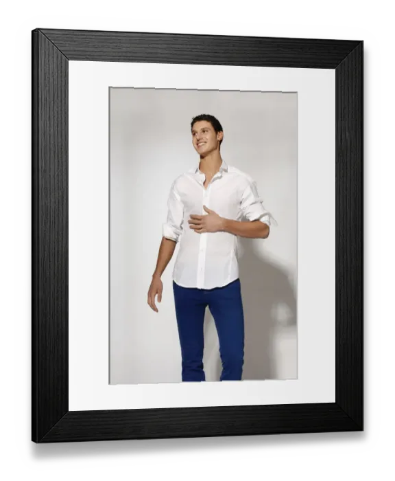 Framed Print : Young man in white shirt and blue jeans in movement Framed Print : Young man in white shirt and blue jeans in movement