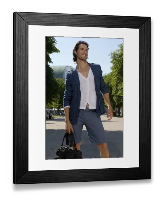 Framed Print : Long-haired man shopping in a city in the summer