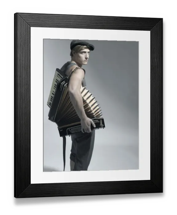 Framed Print : Man carrying an accordion, fashion shoot