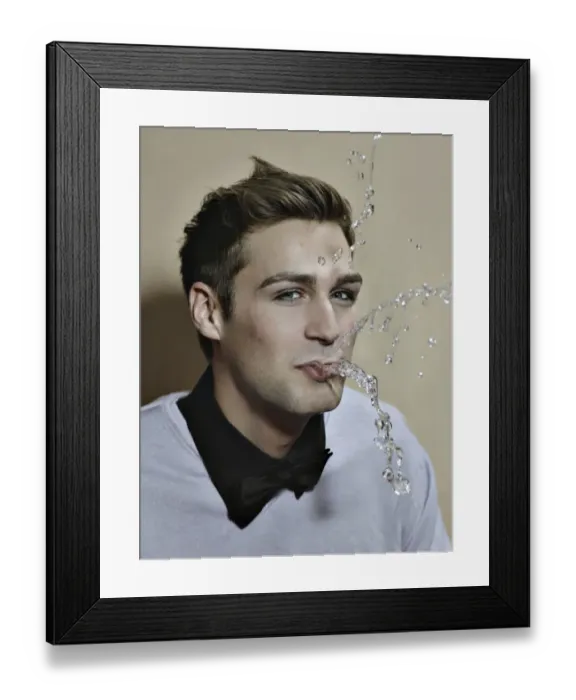 Framed Print : Young man spitting out water Framed Print : Young man spitting out water