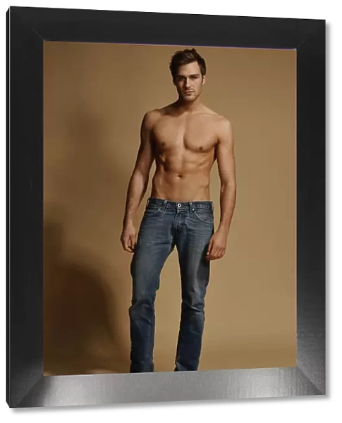 Bare-chested man in jeans