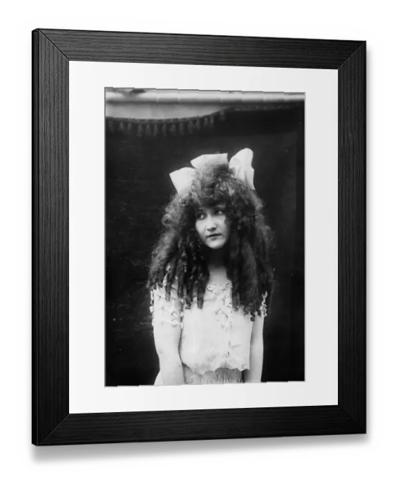 Framed Print : Ringlets. circa 1905: A young woman with her hair in ringlets Framed Print : Ringlets. circa 1905: A young woman with her hair in ringlets