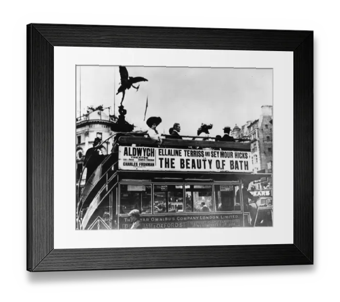 Framed Print : Eros Bus. 1909: The silhouette of the Eros statue hovers above passengers Framed Print : Eros Bus. 1909: The silhouette of the Eros statue hovers above passengers