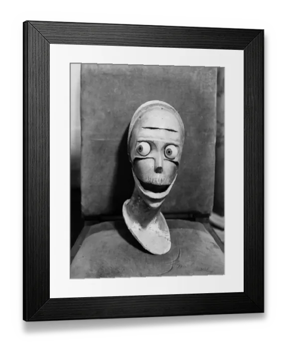 Framed Print : Oh No. A stylised sculpted head with staring eyes and gaping mouth Framed Print : Oh No. A stylised sculpted head with staring eyes and gaping mouth