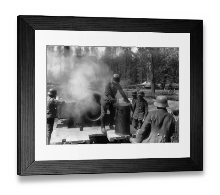 Framed Print : Shellcase. circa 1917: A German gunner removing an empty shellcase from a howitzer Framed Print : Shellcase. circa 1917: A German gunner removing an empty shellcase from a howitzer