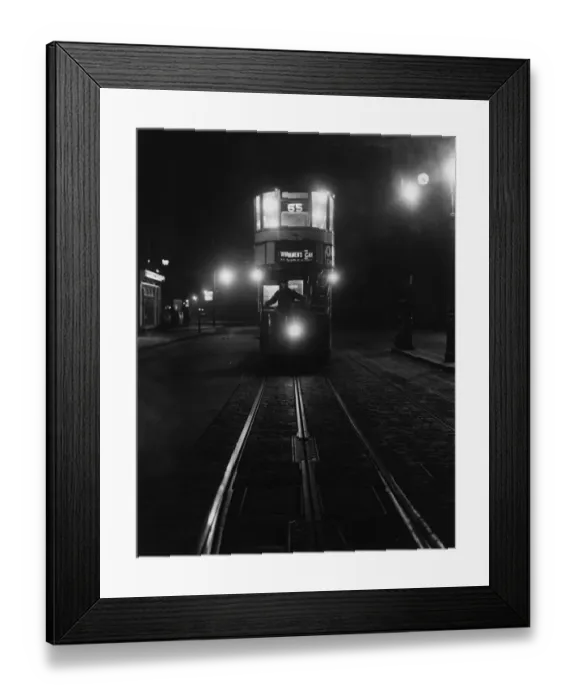 Framed Print : First Up. circa 1929: An early morning Workmans tram on route No 65, travelling Framed Print : First Up. circa 1929: An early morning Workmans tram on route No 65, travelling