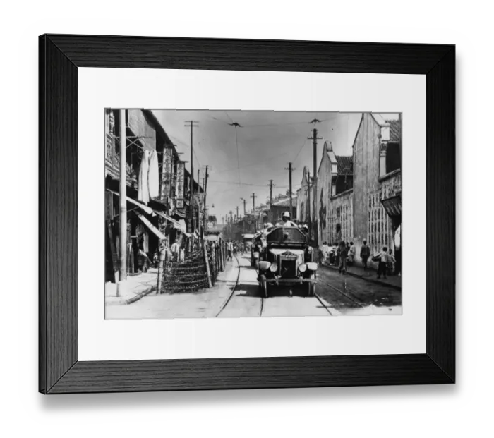Framed Print : Shanghai. circa 1935: A British armoured car patrolling the streets of Framed Print : Shanghai. circa 1935: A British armoured car patrolling the streets of