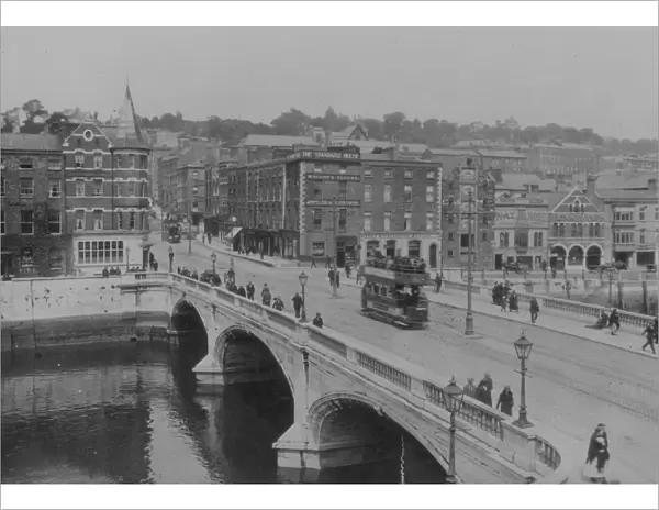 Cork City. circa 1930: A tram crosses the bridge in Cork City, Ireland