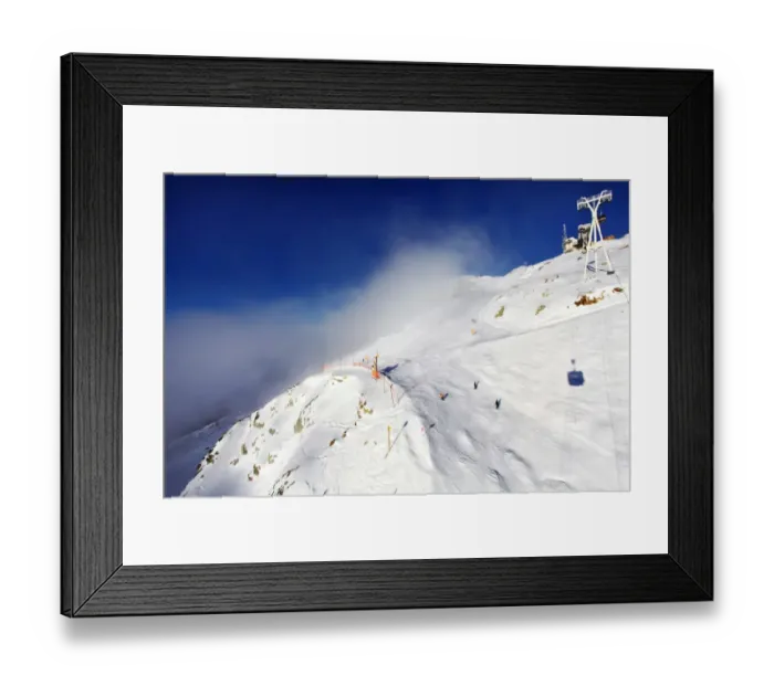 Framed Print : Clouds over Ski Resort mountain in French Alps Framed Print : Clouds over Ski Resort mountain in French Alps