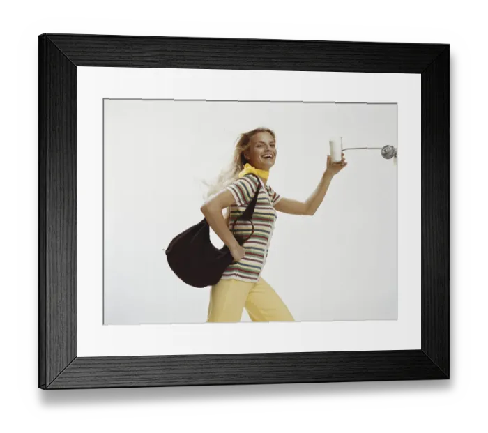 Framed Print : Woman with handbag holding glass of milk, close-up Framed Print : Woman with handbag holding glass of milk, close-up
