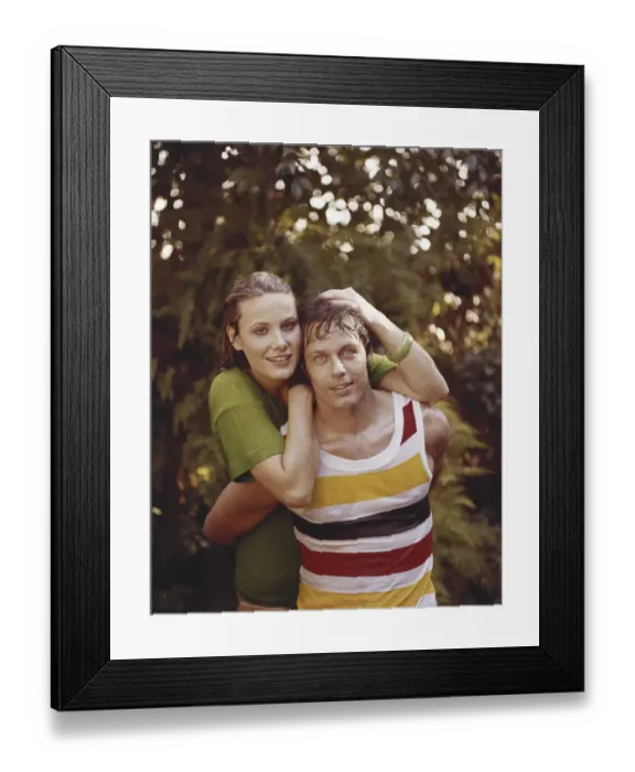 Framed Print : Young woman and man in wet clothes embracing, close-up, portrait, smiling Framed Print : Young woman and man in wet clothes embracing, close-up, portrait, smiling