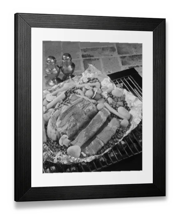 Framed Print : Meat with vegetables in tray on barbecue grill, close-up
