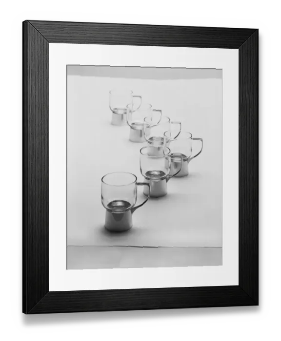 Framed Print : Row of juice extractors against white background