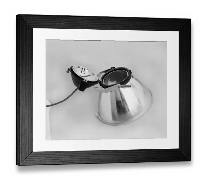 Framed Print : Spotlight against white background, close-up Framed Print : Spotlight against white background, close-up