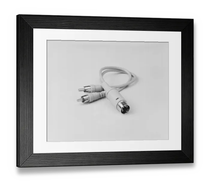 Framed Print : An electrical lead with a DIN end against white background, close-up Framed Print : An electrical lead with a DIN end against white background, close-up