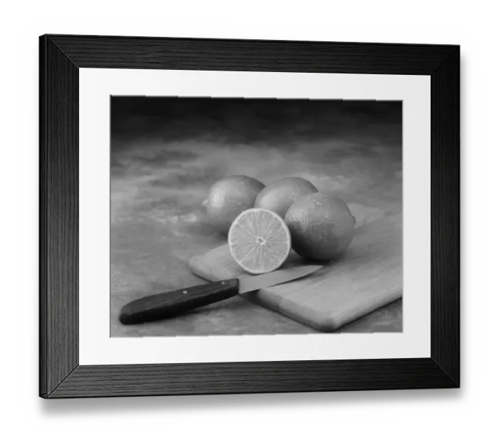 Framed Print : Lemon whole and half cut on chopping board with knife Framed Print : Lemon whole and half cut on chopping board with knife