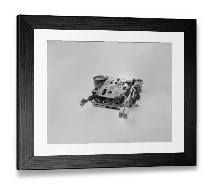 Framed Print : A cassette or disc player part on white background Framed Print : A cassette or disc player part on white background