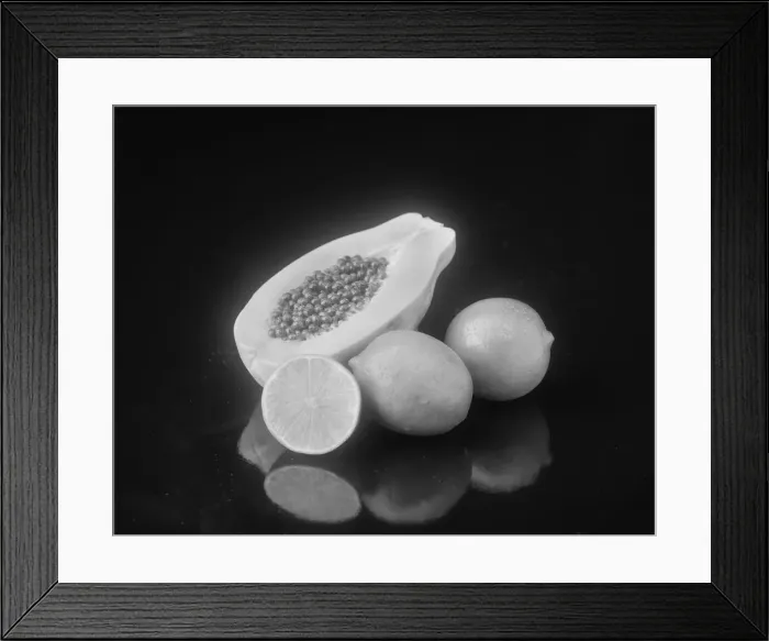 Framed Print : Half cut papaya and lemon on black background Framed Print : Half cut papaya and lemon on black background
