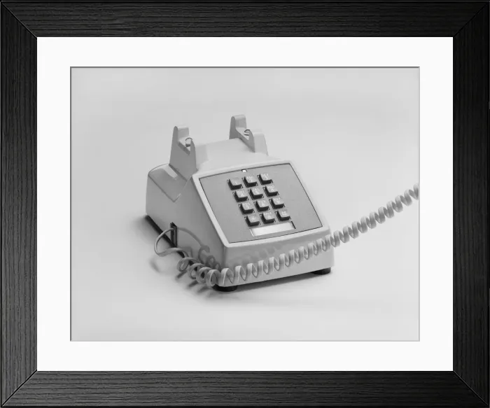 Framed Print : Telephone on white background, close-up Framed Print : Telephone on white background, close-up