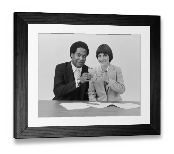 Framed Print : Businessman and woman toasting drink glass, smiling, portrait Framed Print : Businessman and woman toasting drink glass, smiling, portrait