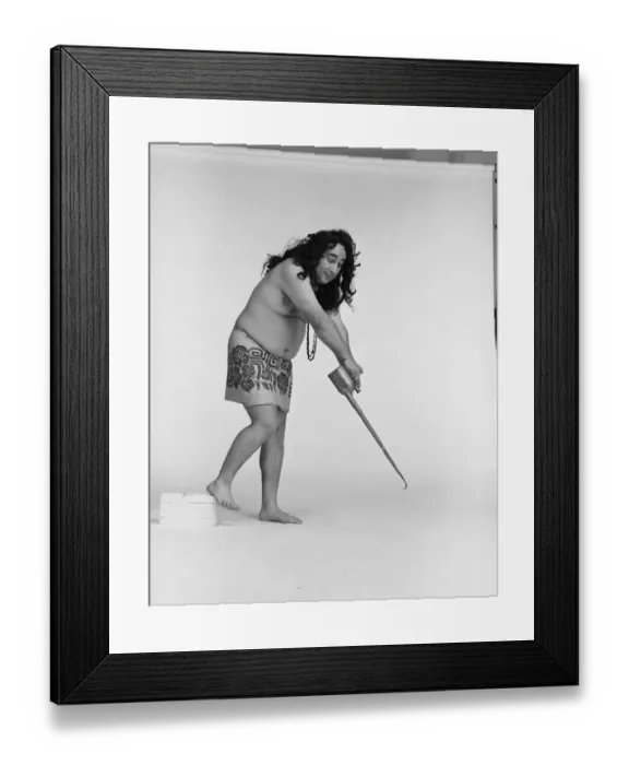Framed Print : Man holding oil can against white background Framed Print : Man holding oil can against white background