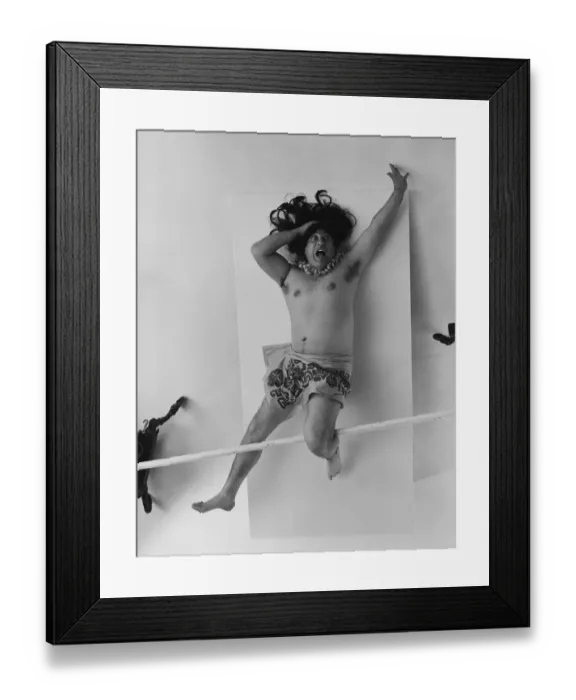 Framed Print : Man in traditional wear lying on white background