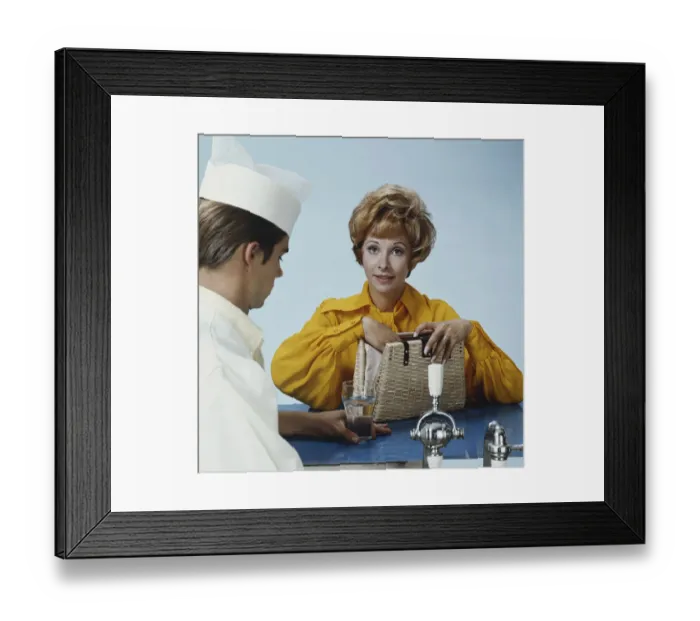 Framed Print : Bartender and woman at bar counter Framed Print : Bartender and woman at bar counter