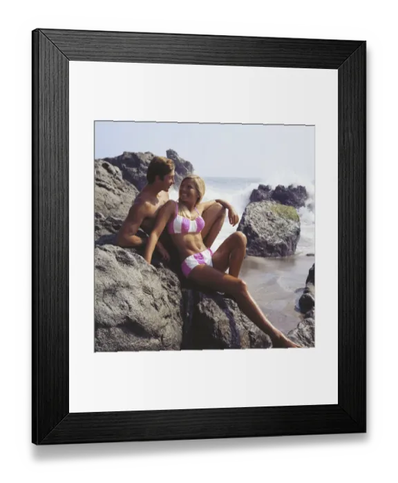 Framed Print : Attractive Couple Posing on a Rock Framed Print : Attractive Couple Posing on a Rock