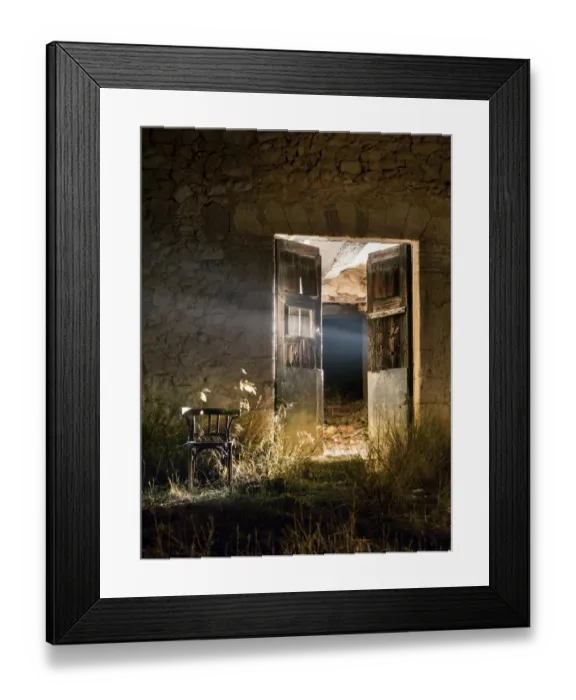 Framed Print : Door of a house in ruins opened in the night with a beam of light Framed Print : Door of a house in ruins opened in the night with a beam of light