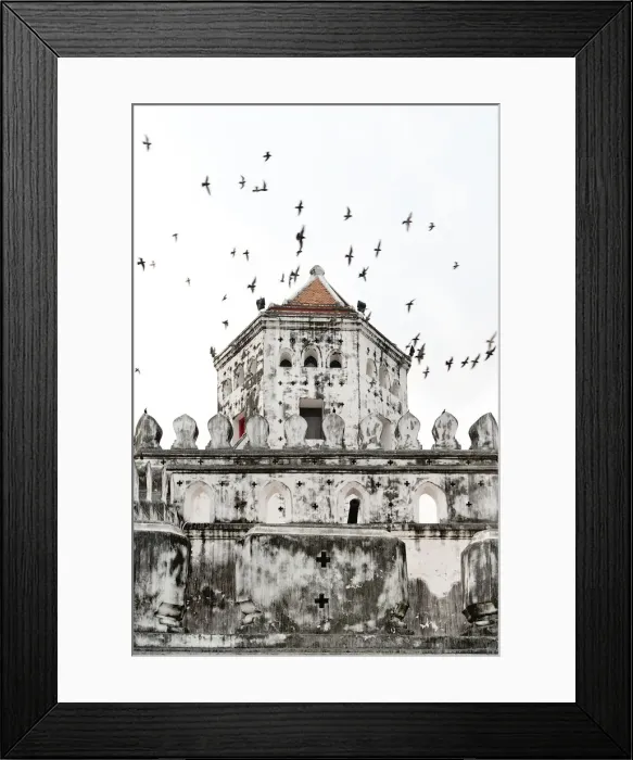 Framed Print : Flock of pigeons fly past a fort Framed Print : Flock of pigeons fly past a fort